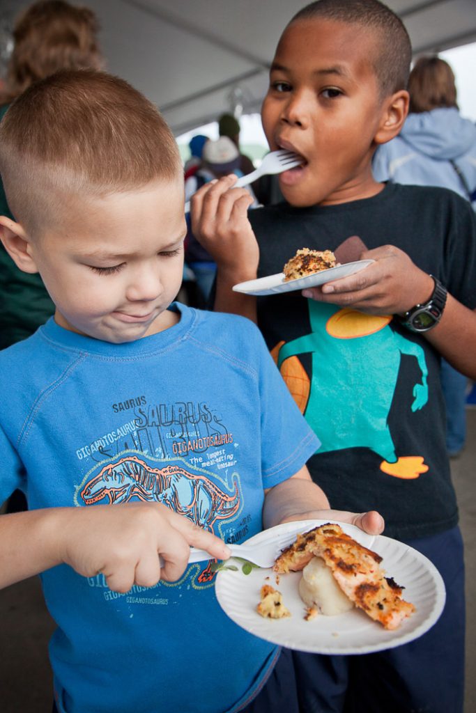 Two boys liking seafood throwndown food - Alaska State Fair